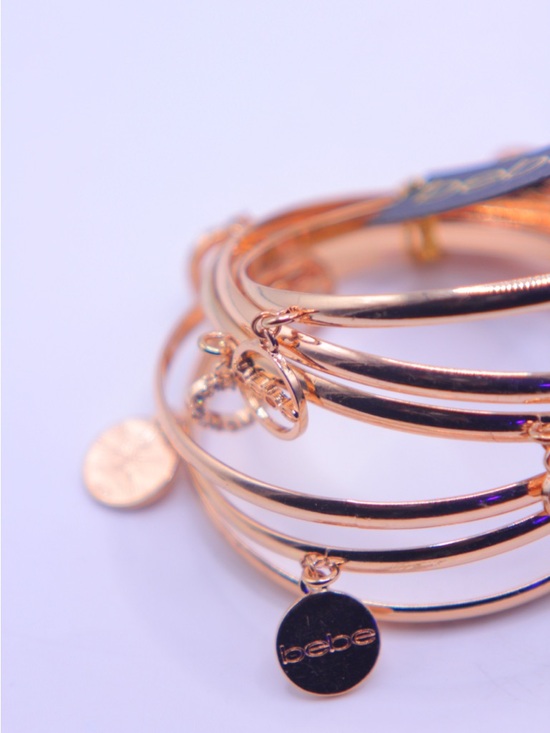 bebe Gold tone Multi-Charm Bangle Set - Picture 2 of 6
